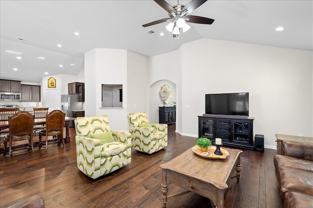 living room featuring lofted ceiling, ceiling fan, and dark hardwood / wood-style flooring