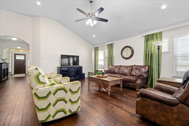 living room featuring ceiling fan, vaulted ceiling, and dark hardwood / wood-style floors