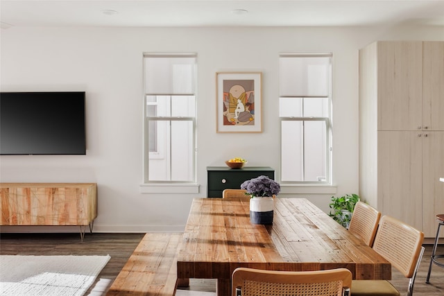 dining space with dark wood-type flooring