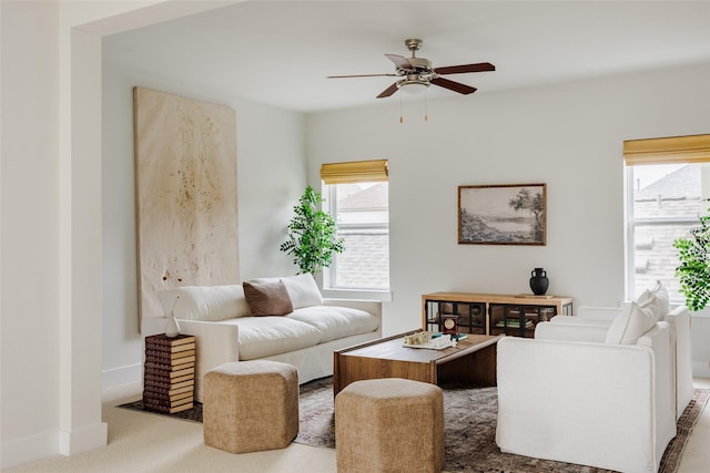 living room with ceiling fan and carpet flooring