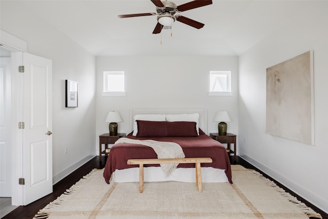 bedroom featuring ceiling fan and dark hardwood / wood-style floors