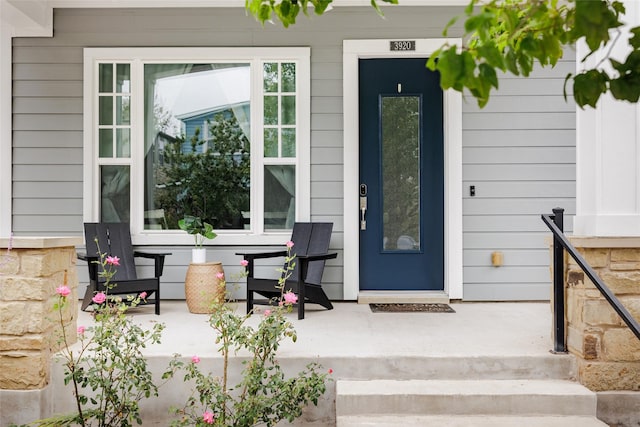 doorway to property featuring covered porch