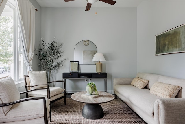 living area featuring ceiling fan