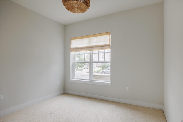 unfurnished room featuring carpet flooring