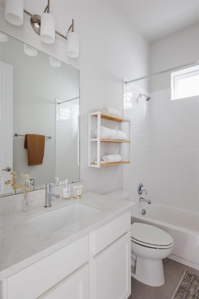 full bathroom with toilet, tiled shower / bath combo, tile patterned flooring, and vanity