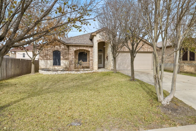 view of front of house with a front yard and a garage