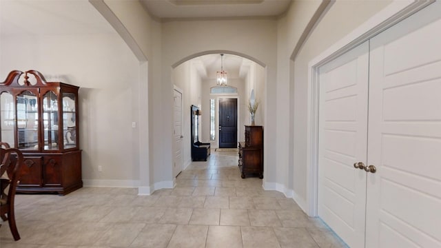 hallway with light tile patterned floors