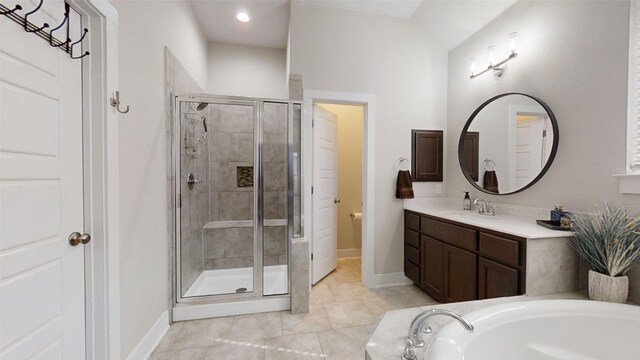 bathroom with tile patterned flooring, plus walk in shower, and vanity