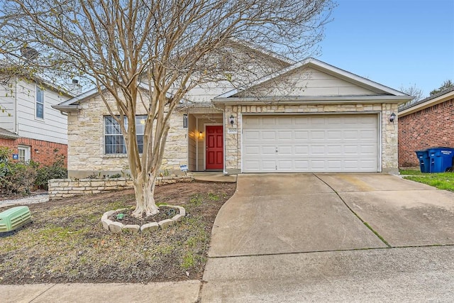 single story home with concrete driveway, stone siding, and an attached garage