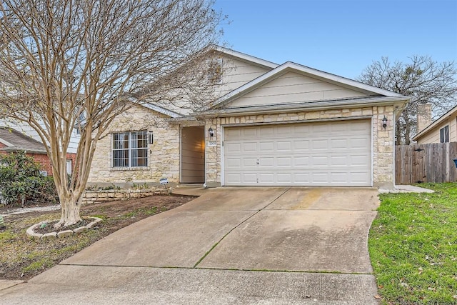 ranch-style house with driveway, stone siding, a garage, and fence