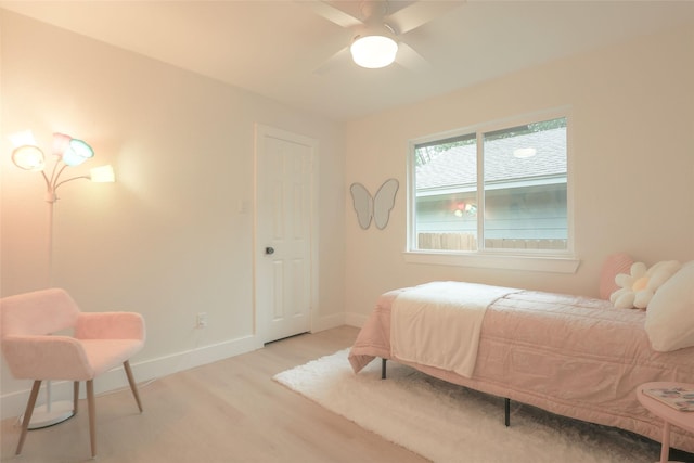 bedroom featuring ceiling fan and light hardwood / wood-style floors