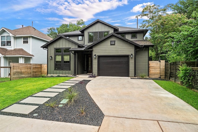 view of front of house featuring a garage and a front lawn