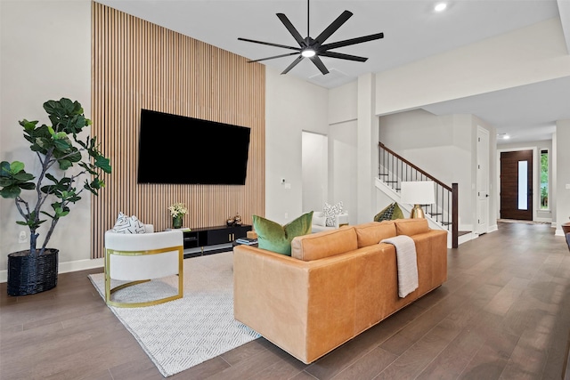 living room with ceiling fan and hardwood / wood-style floors