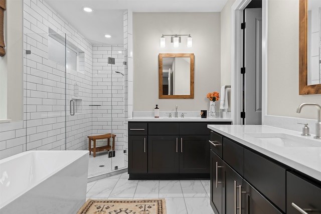 bathroom with independent shower and bath and vanity