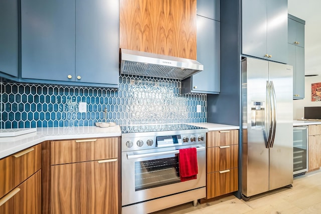 kitchen with stainless steel appliances, wall chimney exhaust hood, light hardwood / wood-style floors, decorative backsplash, and wine cooler