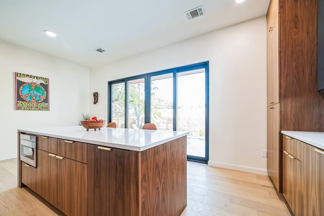 kitchen with light hardwood / wood-style flooring