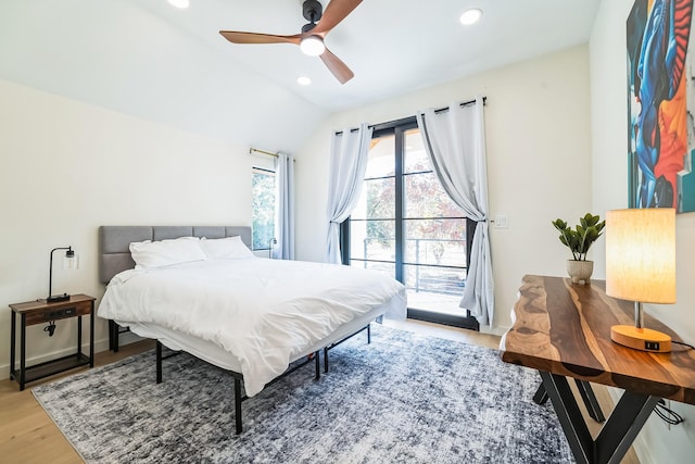 bedroom featuring ceiling fan, light wood-type flooring, lofted ceiling, and access to exterior