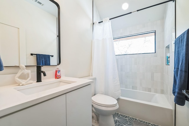 full bathroom with toilet, vanity, and shower / tub combo with curtain