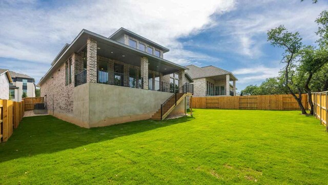 1728 Snowdrop Dr, Georgetown, TX 78628 - rear view of house featuring a fenced backyard and stairway