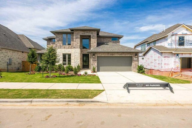1728 Snowdrop Dr, Georgetown, TX 78628 - view of front of property with a garage, brick siding, driveway, and roof with shingles
