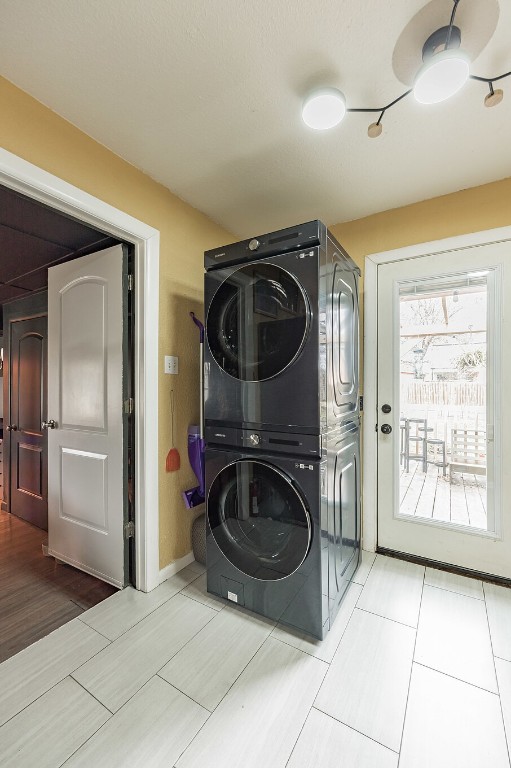 washroom with laundry area and stacked washer and clothes dryer