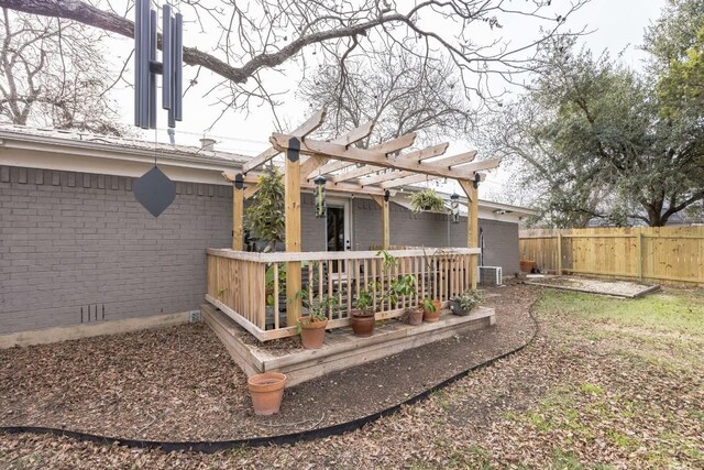 view of yard with a pergola, a deck, and fence