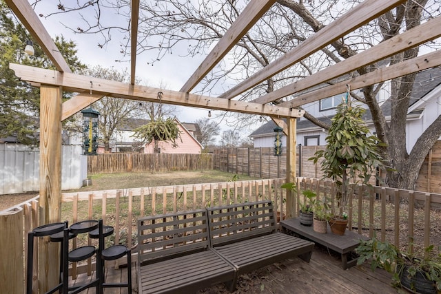 wooden terrace with a lawn