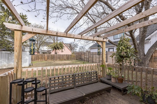 wooden terrace featuring fence and a pergola