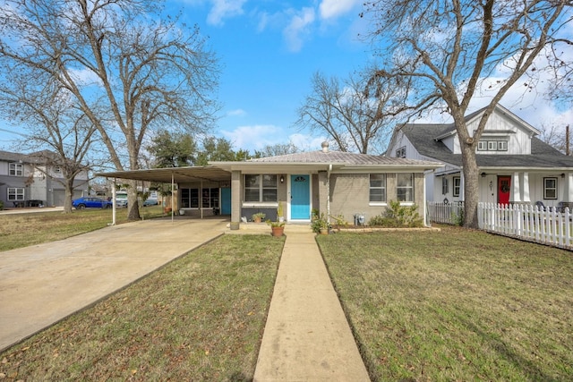 view of front of property featuring a carport, concrete driveway, fence, and a front yard