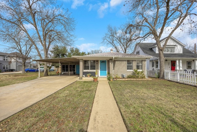 405 W 17th St, Georgetown, TX 78626 - view of front of house featuring fence, an attached carport, concrete driveway, and a front yard