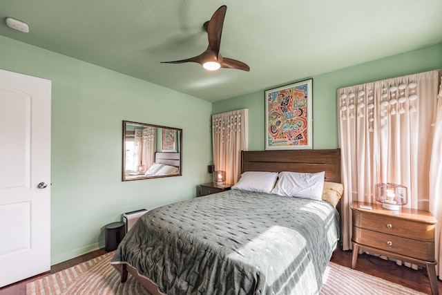 bedroom with hardwood / wood-style floors and ceiling fan