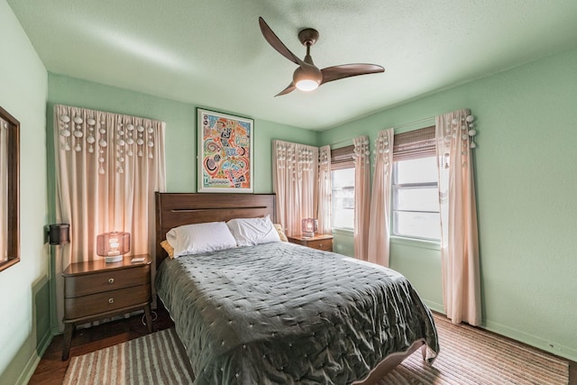 bedroom featuring wood-type flooring and ceiling fan