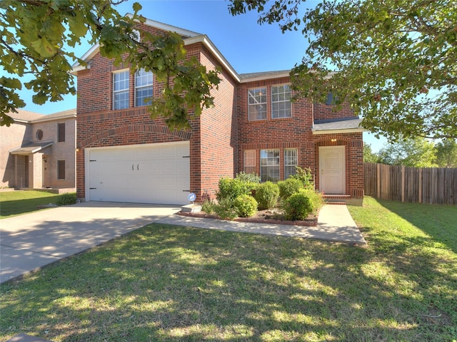 view of front of home featuring a front lawn and a garage