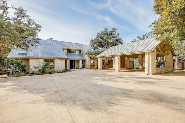 view of front of home with a carport