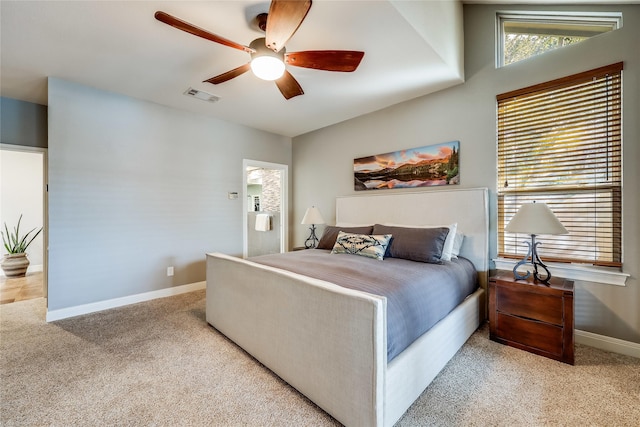 bedroom with ceiling fan and light colored carpet