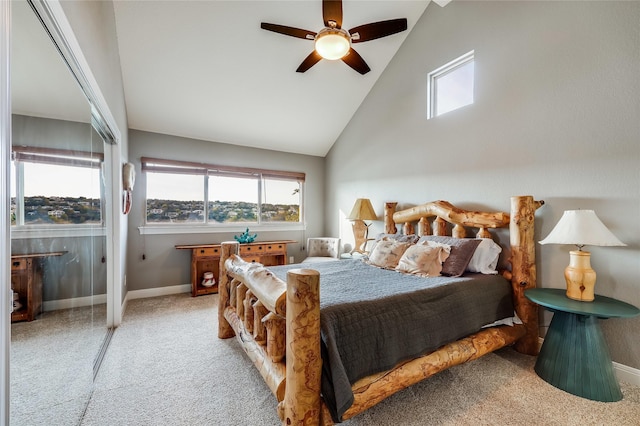 carpeted bedroom featuring ceiling fan and high vaulted ceiling