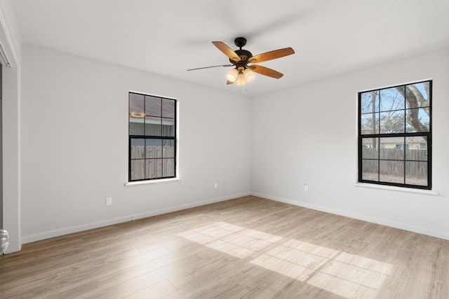 unfurnished room with ceiling fan and light hardwood / wood-style floors