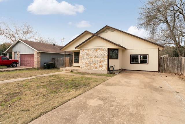 ranch-style house with a front yard and a garage