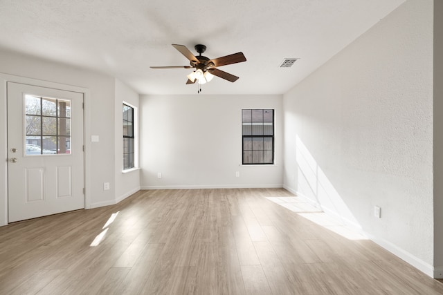 interior space featuring ceiling fan and light hardwood / wood-style flooring