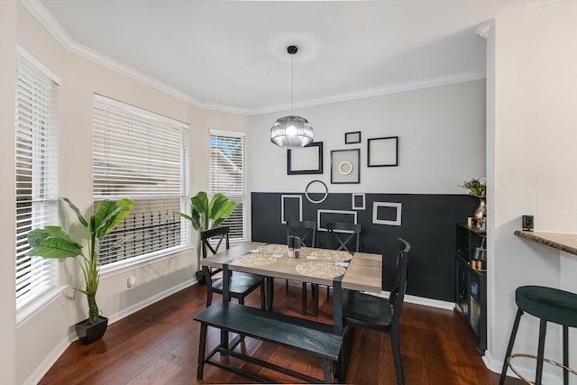 dining space featuring dark hardwood / wood-style floors and crown molding