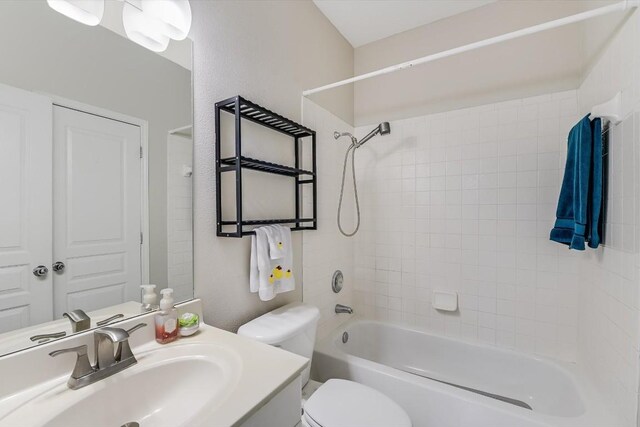 full bathroom featuring shower / bathing tub combination, vanity, and toilet