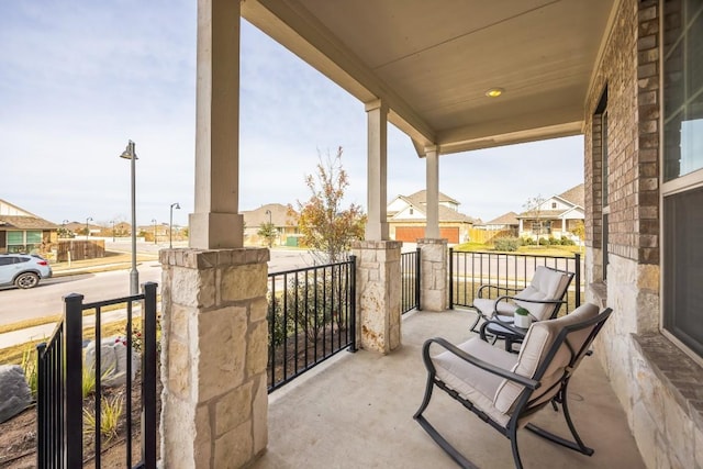 317 Barley Fork Ln, Hutto, TX 78634 - balcony featuring covered porch and a residential view