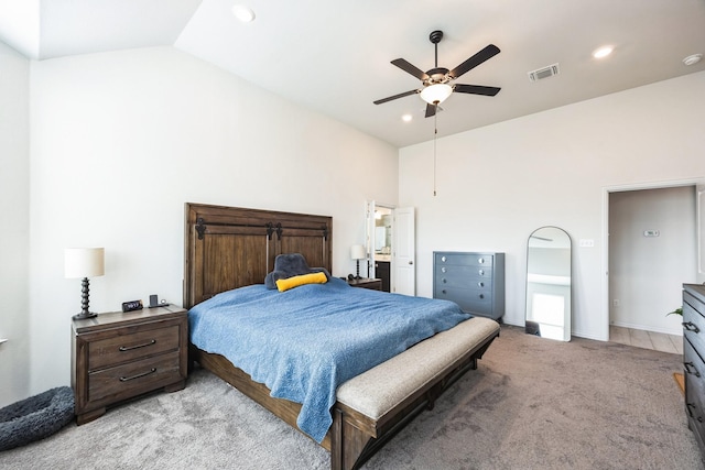 carpeted bedroom featuring ceiling fan and lofted ceiling