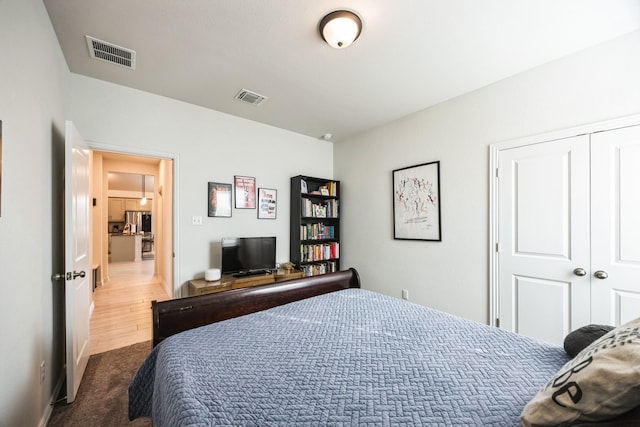 bedroom with a closet and carpet floors