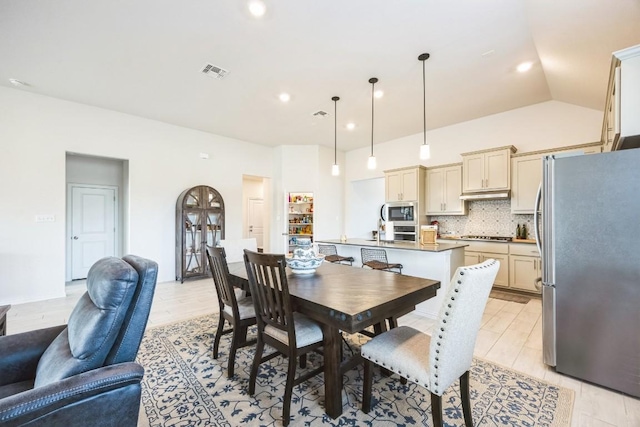 317 Barley Fork Ln, Hutto, TX 78634 - dining room featuring recessed lighting, visible vents, light wood-style flooring, and vaulted ceiling
