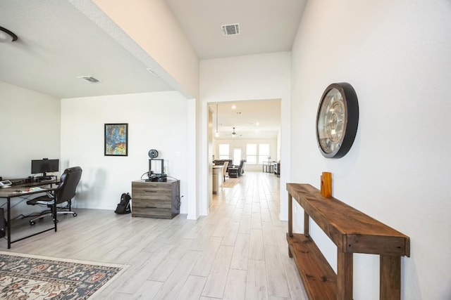 317 Barley Fork Ln, Hutto, TX 78634 - home office featuring light wood-style floors, baseboards, and visible vents