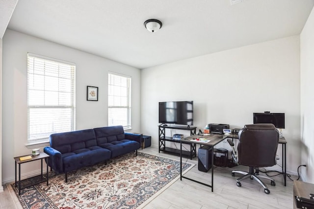 317 Barley Fork Ln, Hutto, TX 78634 - home office featuring baseboards and light wood-style flooring