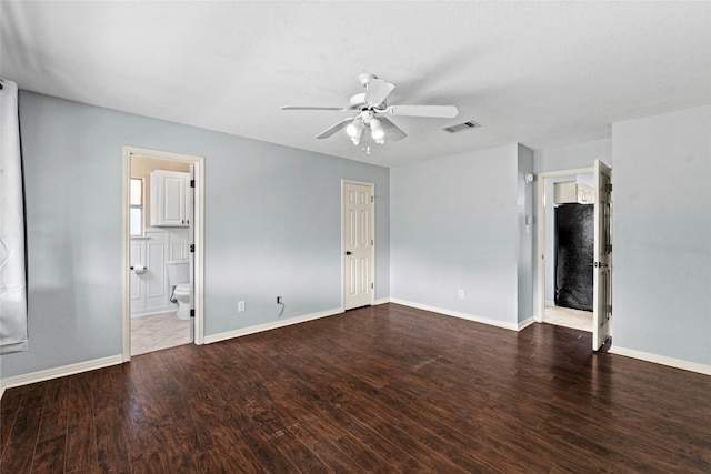 unfurnished room with ceiling fan and dark wood-type flooring