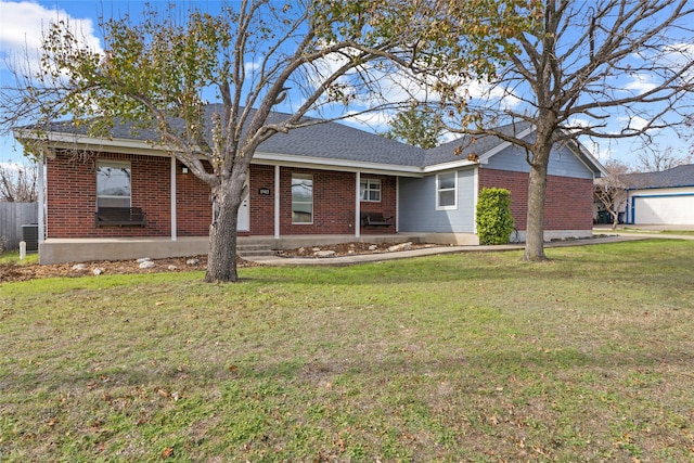 ranch-style house with a front lawn and central AC