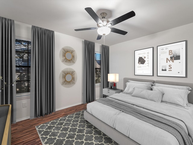 bedroom featuring ceiling fan and dark hardwood / wood-style floors